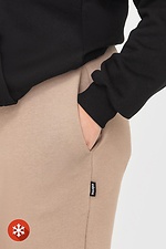 Утепленные зауженные штаны на флисе бежевого цвета Garne 3041059 фото №5
