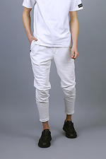Трикотажные спортивные штаны зауженного кроя белого цвета VDLK 8031147 фото №1
