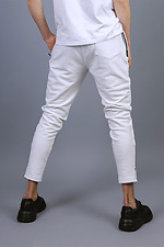 Трикотажные спортивные штаны зауженного кроя белого цвета VDLK 8031147 фото №4