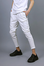 Трикотажные спортивные штаны зауженного кроя белого цвета VDLK 8031147 фото №7