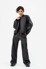 Жіночі широкі штани з еко-шкіри чорного кольору Garne 3041465 фото №6
