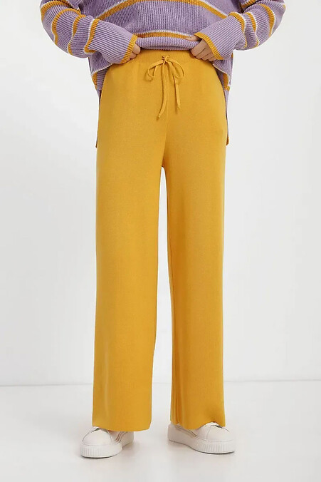 Women's knitted trousers in mustard color - #4038789