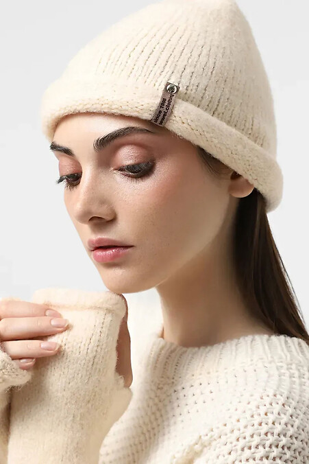 Women's warm knitted hat in beige color - #4038865