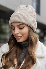 Knitted hat Camellia beige color on fleece  4051047 photo №1
