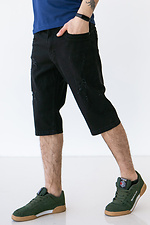 Czarne, postarzane szorty jeansowe poniżej kolan  4009076 zdjęcie №4
