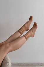 A set of three pairs of thin 15 denier nylon socks in beige  8055089 photo №1