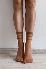 A set of three pairs of thin 15 denier nylon socks in beige  8055089 photo №3