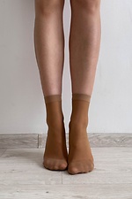 A set of three pairs of thin 20 denier nylon socks in beige  8055093 photo №3
