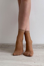 A set of three pairs of thin 20 denier nylon socks in beige  8055093 photo №4