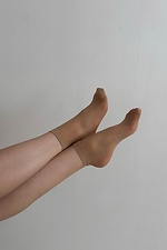 A set of three pairs of thin 20 denier nylon socks in beige  8055097 photo №1