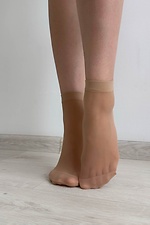 A set of three pairs of thin 20 denier nylon socks in beige  8055097 photo №3