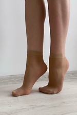 A set of three pairs of thin 20 denier nylon socks in beige  8055097 photo №4