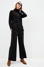 Теплий трикотажний костюм двійка чорного кольору: гольф, широкі штани  4038199 фото №1