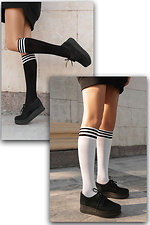 Set aus weißen und schwarzen Golfschlägern. M-SOCKS 2040234 Foto №1