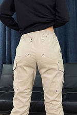 Коттоновые штаны джоггеры бежевого цвета на манжетах GEN 8000251 фото №2