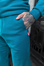Бирюзовые спортивные штаны узкие из трикотажа GEN 8000266 фото №3