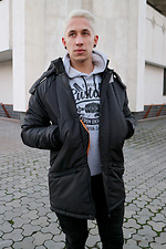 Warmer schwarzer Parka mit langem Schnitt für den Winter mit Kapuze und Strickbündchen Custom Wear 8025342 Foto №1