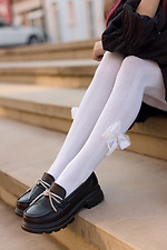 Durchbrochene weiße Kinderstrumpfhose mit Schleife M-SOCKS 2040343 Foto №2