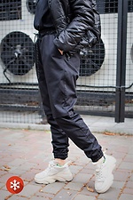 Теплые спортивные штаны джоггеры на флисе в черном цвете Without 8048368 фото №1