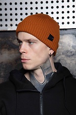 Warm knitted red hat with a lapel Custom Wear 8025382 photo №1