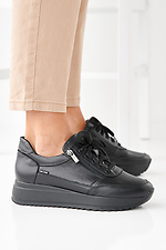 Damen-Sneakers aus schwarzem Leder fr Frhling und Herbst 2505385 Foto №4