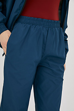 Жіночі спортивні штани з плащової тканини на манжетах Garne 3038489 фото №4