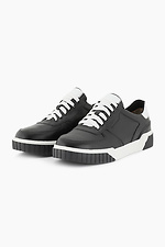 Black leather sneakers on a white platform  4205590 photo №2