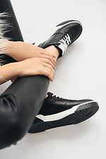 Black leather sneakers on a white platform  4205590 photo №3