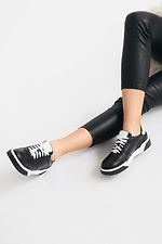 Black leather sneakers on a white platform  4205590 photo №4