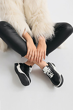Black leather sneakers on a white platform  4205590 photo №5
