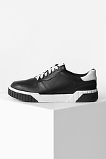 Black leather sneakers on a white platform  4205590 photo №6