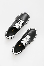 Black leather sneakers on a white platform  4205590 photo №7