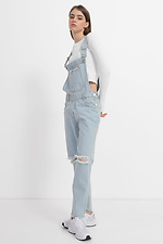 Жіночий джинсовий комбінезон з рваними колінами  4014594 фото №1