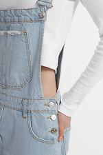 Жіночий джинсовий комбінезон з рваними колінами  4014594 фото №5